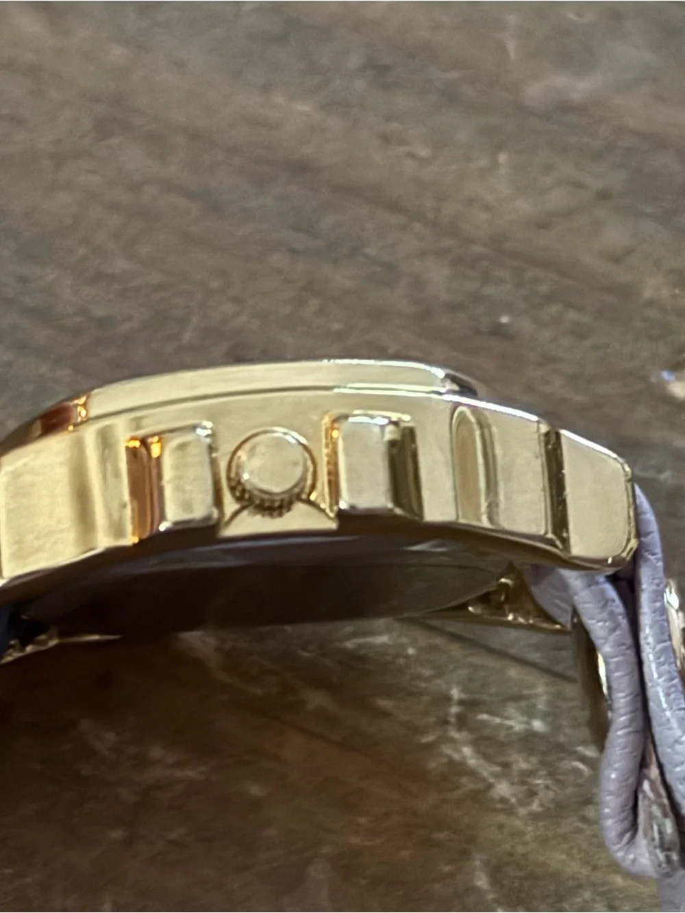LA Mer Collections gold chain and leather wrap bracelet watch